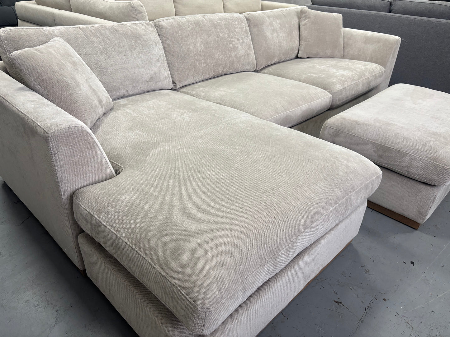 Beige Sectional With Ottoman