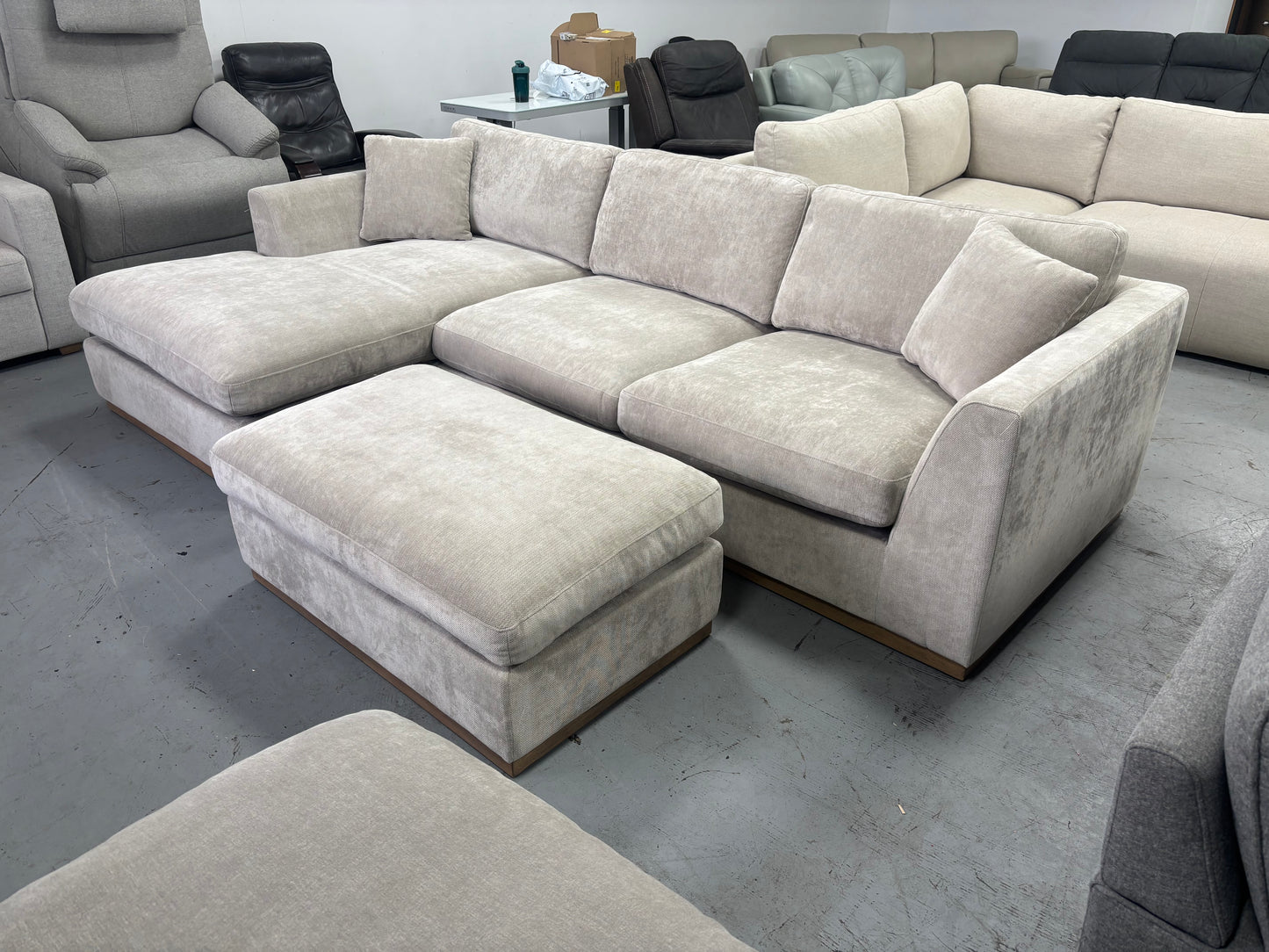 Beige Sectional With Ottoman